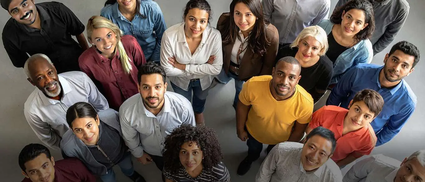 Group of people smiling and looking up